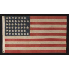 45 STARS IN A "NOTCHED" DESIGN ON A SMALL SCALE FLAG OF THE 1896-1907 PERIOD, LEAVING SPACE OPEN FOR THE FUTURE ADDITION OF THREE MORE WESTERN TERRITORIES, OWNED AND POSSIBLY MADE BY ALVAH WOODBURY, A SHOEMAKER, OF BEVERLY MASSACHUSETTS