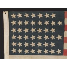 45 STARS IN A "NOTCHED" DESIGN ON A SMALL SCALE FLAG OF THE 1896-1907 PERIOD, LEAVING SPACE OPEN FOR THE FUTURE ADDITION OF THREE MORE WESTERN TERRITORIES, OWNED AND POSSIBLY MADE BY ALVAH WOODBURY, A SHOEMAKER, OF BEVERLY MASSACHUSETTS