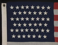 45 STARS ON THE SMALLEST PIECED-AND-SEWN, WOOL BUNTING, COMMERCIALLY MANUFACTURED FLAG THAT I HAVE EVER ENCOUNTERED, FLOWN AT AN INN IN OREGON DURING THE PATRIOTISM THAT SURROUNDED THE SPANISH-AMERICAN WAR, 1896-1908, UTAH STATEHOOD