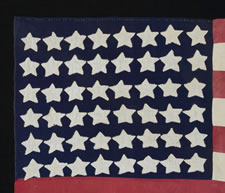 48 STAR FLAG, CANTON RESTING ON THE WAR STRIPE, MADE IN FRANCE DURING WWII TO WELCOME U.S. TROOPS INTO EPINAL IN 1944, FOLLOWING LIBERATION