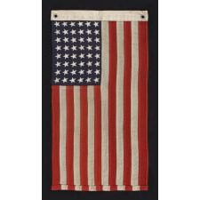 48 STAR, U.S. NAVY SMALL BOAT ENSIGN, MADE AT MARE ISLAND, CALIFORNIA DURING WWII, SIGNED AND DATED 1944, IN THE SMALLEST SCALE EMPLOYED AT THE TIME: