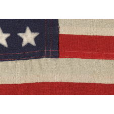 48 STAR, U.S. NAVY SMALL BOAT ENSIGN, MADE AT MARE ISLAND, CALIFORNIA DURING WWII, SIGNED AND DATED 1944, IN THE SMALLEST SCALE EMPLOYED AT THE TIME