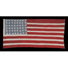 48 STARS ON AN AMERICAN FLAG MADE BY FRENCH RESISTANCE DURING WWII, PRESENTED TO THE 3RD SQUAD OF THE 8TH INFANTRY REGIMENT (MOTORIZED, 4TH INFANTRY DIVISION) FOLLOWING THEIR PARTICIPATION IN THE BATTLE OF NORMANDY, IN GRATITUDE OF THE NATION'S FORTHCOMING LIBERATION IN 1944, A WONDERFUL EXAMPLE