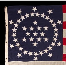 48 STARS ON AN ANTIQUE AMERICAN FLAG DESIGNED AND COMMISSIONED BY WAYNE WHIPPLE, AN EXTRAORDINARY DESIGN AND ONE OF JUST TWO KNOWN EXAMPLES WITH PIECED-AND-SEWN CONSTRUCTION, 1909-1912