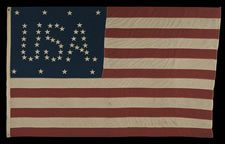 48 STARS CONFIGURED INTO THE LETTERS "U.S.A.", COPYWRITTEN IN 1916 BY C.A. HARTMAN, ONE OF ONLY THREE KNOWN SURVIVING EXAMPLES AND ONE OF THE MOST INTERESTING DESIGNS KNOWN TO EXIST IN EARLY FLAGS