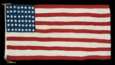 48 STARS, AN ELONGATED HOMEMADE FLAG WITH CRUDE FOLK FEATURES, FOUND IN BRITAIN, LIKELY MADE IN FRANCE OR BELGIUM, FLOWING LIBERATION FROM THE GERMANS DURING WWII (1941-45)