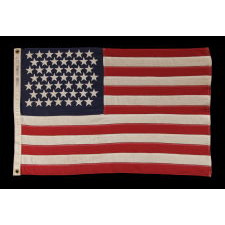 49 STARS ON A SMALL SCALE PIECED-AND-SEWN AMERICAN FLAG REFLECTING THE ADDITION OF ALASKA IN 1959, OFFICIAL FOR JUST ONE YEAR, MADE BY DETTRA IN OAKS, PENNSYLVANIA