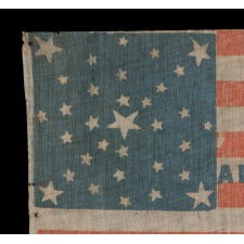 1860 ABRAHAM LINCOLN CAMPAIGN PARADE FLAG WITH 33 STARS IN AN EXTREMELY UNUSUAL VARIATION OF A MEDALLION CONFIGURATION, EXTREMELY RARE, ONE OF PERHAPS JUST TWO KNOWN EXAMPLES