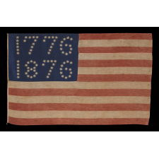 ANTIQUE AMERICAN FLAG WITH 10-POINTED STARS THAT SPELL “1776 – 1876”, MADE FOR THE 100-YEAR ANNIVERSARY OF AMERICAN INDEPENDENCE, ONE OF THE MOST GRAPHIC OF ALL EARLY EXAMPLES