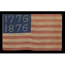 ANTIQUE AMERICAN FLAG WITH 10-POINTED STARS THAT SPELL “1776 – 1876”, MADE FOR THE 100-YEAR ANNIVERSARY OF AMERICAN INDEPENDENCE, ONE OF THE MOST GRAPHIC OF ALL EARLY EXAMPLES