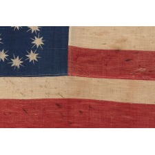 ANTIQUE AMERICAN FLAG WITH 10-POINTED STARS THAT SPELL “1776 – 1876”, MADE FOR THE 100-YEAR ANNIVERSARY OF AMERICAN INDEPENDENCE, ONE OF THE MOST GRAPHIC OF ALL EARLY EXAMPLES: