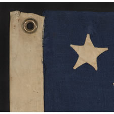 ANTIQUE AMERICAN FLAG WITH 13 HAND-SEWN STARS IN A 3-2-3-2-3 CONFIGURATION, IN AN EXTREMELY SCARCE, SMALL SIZE FOR THE PERIOD, 1876 CENTENNIAL ERA