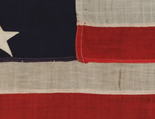 ANTIQUE AMERICAN FLAG WITH 13 STARS IN A 3-2-3-2-3 PATTERN, ARRANGED IN A HIGHLY UNUSUAL VERTICAL COLUMN;  A SMALL-SCALE EXAMPLE OF THE 1895-1910 ERA