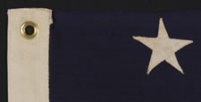 ANTIQUE AMERICAN FLAG WITH 13 STARS IN A 3-2-3-2-3 PATTERN, ARRANGED IN A HIGHLY UNUSUAL VERTICAL COLUMN;  A SMALL-SCALE EXAMPLE OF THE 1895-1910 ERA