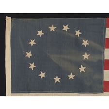 ANTIQUE AMERICAN FLAG WITH 13 STARS IN THE BETSY ROSS PATTERN, A HOMEMADE, MAKE-DO EXAMPLE OF THE 1926-1945 ERA