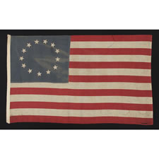 ANTIQUE AMERICAN FLAG WITH 13 STARS IN THE BETSY ROSS PATTERN, A HOMEMADE, MAKE-DO EXAMPLE OF THE 1926-1945 ERA