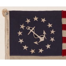 ANTIQUE AMERICAN PRIVATE YACHT FLAG (ENSIGN) WITH 13 STARS SURROUNDING A CANTED ANCHOR, CIRCA 1910 – 1920’s