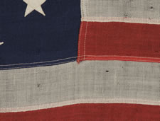 ANTIQUE PRIVATE YACHT FLAG (ENSIGN) WITH 13 STARS AND A FOULED ANCHOR, MARKED "U.S. ARMY STANDARD BUNTING", 1895-1910 ERA