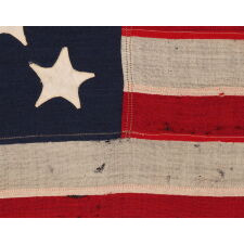 18 STAR ANTIQUE AMERICAN FLAG WITH 13 STRIPES, LIKELY MADE TO COMMEMORATE THE 1812 ADMISSION OF LOUISIANA AS THE 18TH STATE, AND PRODUCED EITHER FOR THE 1893 CHICAGO WORLD’S FAIR, OR THE 1876 PHILADELPHIA WORLD’S FAIR, ATTRIBUTED TO LEADING, CIVIL WAR, U.S. ARMY ENGINEER & CHICAGO ARCHITECT, WILLIAM LeBARON JENNEY