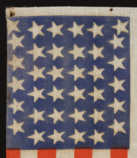 CIVIL WAR ERA PARADE FLAG WITH 36 STARS IN A VERY RARE FORM THAT DISPLAYS A "U" FOR UNION