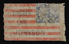 CIVIL WAR PERIOD CAMPAIGN PARADE FLAG MADE FOR THE 1864 PRESIDENTIAL RUN OF ABRAHAM LINCOLN & ANDREW JOHNSON, WITH ENDEARING WEAR FROM OBVIOUS LONG-TERM USE, 34 STARS IN A GREAT-STAR-IN-A-WREATH PATTERN, ONE-OF-A-KIND AMONG KNOWN EXAMPLES