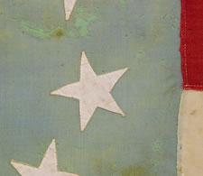 CONFEDERATE 1ST NATIONAL FORMAT FLAG (STARS & BARS) WITH A RARE, CRESCENT STAR FORMATION, CAPTURED BY  LT. CHARLES H.B. CALDWELL