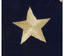 CONFEDERATE OFFICER'S FLAG OR GUIDON IN THE 1ST NATIONAL (STARS & BARS)  PATTERN, HAND-SEWN SILK WITH 7 HAND-EMBROIDERED STARS IN A WREATH PATTERN, SAID TO HAVE BEEN MADE BY "LADIES IN RALEIGH" FOR THE 1ST NORTH CAROLINA INFANTRY