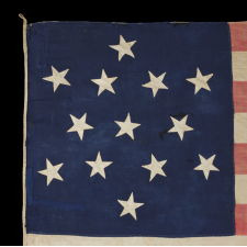 ENTIRELY HAND-SEWN 13 STAR FLAG WITH A 6-POINTED GREAT STAR / STAR OF DAVID PATTERN, ONE OF A TINY HANDFUL OF PIECED-AND-SEWN EXAMPLES WITH THIS EXTRAORDINARILY RARE STAR DESIGN, MADE DURING THE CIVIL WAR ERA (1861-65), WITH ENDEARING GRAPHICS, WEAR, AND EARLY REPAIRS: