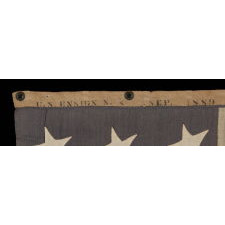 ENTIRELY HAND-SEWN, 13 STAR, U.S. NAVY SMALL BOAT ENSIGN WITH A DUSTY BLUE CANTON, SIGNED AND DATED, 1889