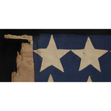 ENTIRELY HAND-SEWN 34 STAR FLAG OF THE CIVIL WAR PERIOD WITH A GREAT EARLY APPEARANCE, A WIDE LINEN SLEEVE, AND A VERY UNUSUAL ARRANGEMENT OF UNCOMMONLY LARGE STARS, 1861-63