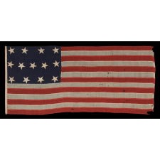 ENTIRELY HAND-SEWN, U.S. NAVY SMALL BOAT ENSIGN OF THE CIVIL WAR PERIOD, WITH 13 STARS IN A 4-5-4 CONFIGURATION, IN THE SMALLEST REGULATION SIZE RECORDED BY THE NAVY DURING THIS GENERAL ERA