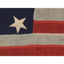 ENTIRELY HAND-SEWN, U.S. NAVY SMALL BOAT ENSIGN OF THE CIVIL WAR PERIOD, WITH 13 STARS IN A 4-5-4 CONFIGURATION, IN THE SMALLEST REGULATION SIZE RECORDED BY THE NAVY DURING THIS GENERAL ERA