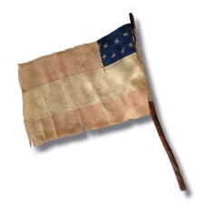 EXCEPTIONAL CONFEDERATE 1ST NATIONAL PATTERN BIBLE FLAG WITH A CRESCENT FORMATION OF 11 STARS, 2 OF WHICH APPEAR TO HAVE BEEN SUBSEQUENTLY ADDED AS MORE STATES SECEDED FROM THE UNION; MADE ca MARCH-MAY, 1861, UPDATED BETWEEN THEN AND OCTOBER; FOUND AMONG A COLLECTION OF LETTERS WRITTEN BY TWO NEW ENGLAND SOLDIERS, PROBABLE UNION CAPTURE