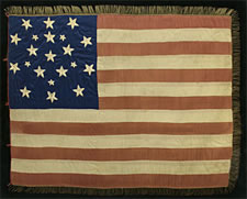 EXCEPTIONALLY RARE AND EARLY, 21-STAR AMERICAN NATIONAL FLAG, WITH EMBROIDERED STARS IN TWO SIZES, ARRANGED IN A FANCIFUL SNOWFLAKE MEDALLION; ILLINOIS STATEHOOD, 1818-1820