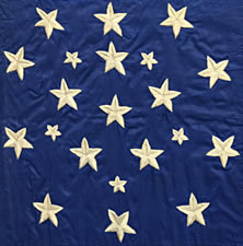 EXCEPTIONALLY RARE AND EARLY, 21-STAR AMERICAN NATIONAL FLAG, WITH EMBROIDERED STARS IN TWO SIZES, ARRANGED IN A FANCIFUL SNOWFLAKE MEDALLION; ILLINOIS STATEHOOD, 1818-1820