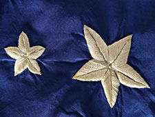 EXCEPTIONALLY RARE AND EARLY, 21-STAR AMERICAN NATIONAL FLAG, WITH EMBROIDERED STARS IN TWO SIZES, ARRANGED IN A FANCIFUL SNOWFLAKE MEDALLION; ILLINOIS STATEHOOD, 1818-1820