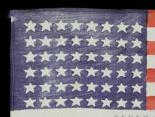 EXTRAORDINARILY RARE 48 STAR PARADE FLAG WITH "REMEMBER PEARL HARBOR" OVERPRINT, USED IN A PARADE IN DERRY, NH, 1942