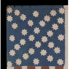 EXTRAORDINARY 34 STAR, CIVIL WAR PERIOD FLAG WITH EIGHT-POINTED STARS IN A "PROPELLER" MEDALLION ON ONE SIDE AND A DOUBLE-WREATH CONFIGURATION OF FIVE-POINTED STARS ON THE OTHER; A HOMEMADE EXAMPLE WITH ITS STRIPES STARTING AND ENDING ON WHITE; EXTREMELY SMALL IN SCALE AMONG ITS COUNTERPARTS AND A MASTERPIECE IN ALL RESPECTS, KANSAS STATEHOOD, 1861-1863