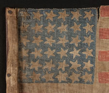 EXTREMELY RARE, 36 STAR, OVERPRINTED PARADE FLAG, MADE FOR THE 1872 PRESIDENTIAL CAMPAIGN OF ULYSSES S. GRANT & HENRY WILSON, ON ITS ORIGINAL, CARVED WOODEN STAFF