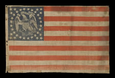 EXTREMELY RARE PARADE FLAG WITH 36 STARS AND AN EAGLE IN THE CANTON, AN IMPORTANT, UNDOCUMENTED EXAMPLE AND THE ONLY ONE OF ITS KIND KNOWN TO EXIST IN THIS STAR COUNT