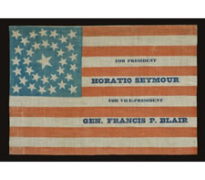 EXTREMELY RARE PARADE FLAG MADE FOR THE 1868 PRESIDENTIAL CAMPAIGN OF HORATIO SEYMOUR AND FRANCIS PRESTON BLAIR, JR., MEDALLION STAR CONFIGURATION ON A CORNFLOWER BLUE CANTON, UNUSUAL, DARKER BLUE OVERPRINT, THE ONLY KNOWN EXAMPLE IN THIS STYLE