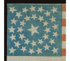 EXTREMELY RARE PARADE FLAG MADE FOR THE 1868 PRESIDENTIAL CAMPAIGN OF HORATIO SEYMOUR AND FRANCIS PRESTON BLAIR, JR., MEDALLION STAR CONFIGURATION ON A CORNFLOWER BLUE CANTON, UNUSUAL, DARKER BLUE OVERPRINT, THE ONLY KNOWN EXAMPLE IN THIS STYLE