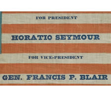 EXTREMELY RARE PARADE FLAG MADE FOR THE 1868 PRESIDENTIAL CAMPAIGN OF HORATIO SEYMOUR AND FRANCIS PRESTON BLAIR, JR., MEDALLION STAR CONFIGURATION ON A CORNFLOWER BLUE CANTON, UNUSUAL, DARKER BLUE OVERPRINT, THE ONLY KNOWN EXAMPLE IN THIS STYLE