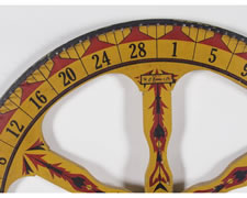 GAME WHEEL IN CHROME YELLOW PAINT WITH DECORATION REMINISCENT OF AMERICAN INDIAN ART, CHICAGO, 1910-20