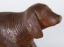 HAND-CARVED, WOODEN SETTER OR SPANIEL DOG WITH RED PAINTED SURFACE, CA 1920-40