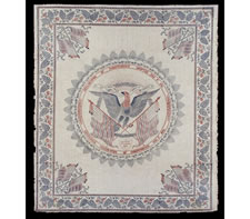 LARGE, BLOCK-PRINTED, 1876 CENTENNIAL BANNER WITH EAGLE MEDALLION; ONE OF THREE KNOWN EXAMPLES, THE ONLY ONE IN RED, WHITE, AND BLUE