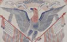 LARGE, BLOCK-PRINTED, 1876 CENTENNIAL BANNER WITH EAGLE MEDALLION; ONE OF THREE KNOWN EXAMPLES, THE ONLY ONE IN RED, WHITE, AND BLUE