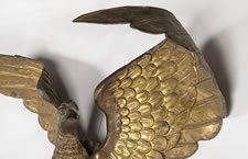 LARGE AND IMPRESSIVE PRESSED BRASS EAGLE, AN EARLY PARADE FLAG HOLDER & BUNTING TIE-BACK, MADE IN NEW YORK, PATENTED 1891