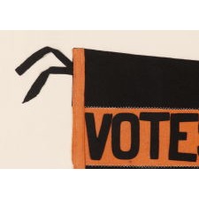 LARGE, SWALLOWTAILED, SUFFRAGETTE PENNANT IN A BLACK & ORANGE COLOR COMBINATION UNIQUE TO THIS EXAMPLE, WITH APPLIED LETTERING THAT READS "VOTES FOR WOMEN” DOWN A WIDE, CENTRAL STRIPE, THIS PRECISE EXAMPLE ILLUSTRATED IN THE BEST REFERENCE ON SUFFRAGE OBJECTS, POSSIBLY WITH TIES TO NEW JERSEY; MADE circa 1912-1919