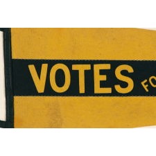 LARGE, SWALLOWTAILED, YELLOW SUFFRAGETTE PENNANT WITH APPLIED LETTERING THAT READS "VOTES FOR WOMEN” DOWN A WIDE BLACK STRIPE, CIRCA 1910-1920